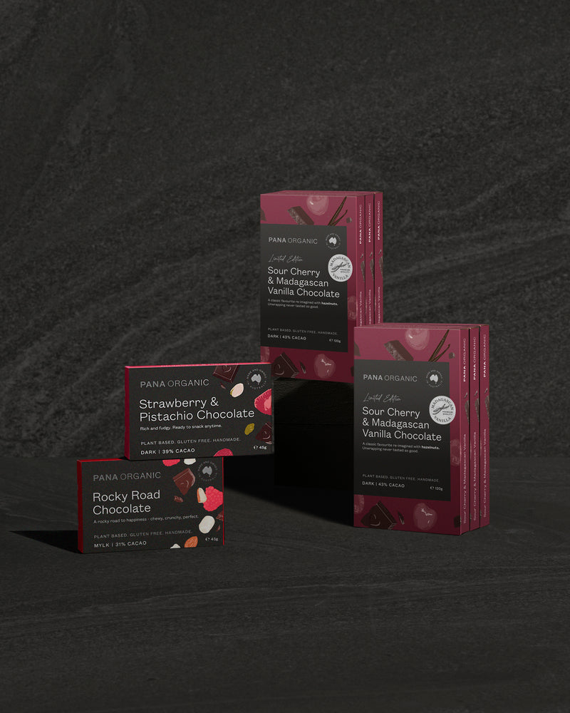 Pana Organic chocolate bars on a dark textured background