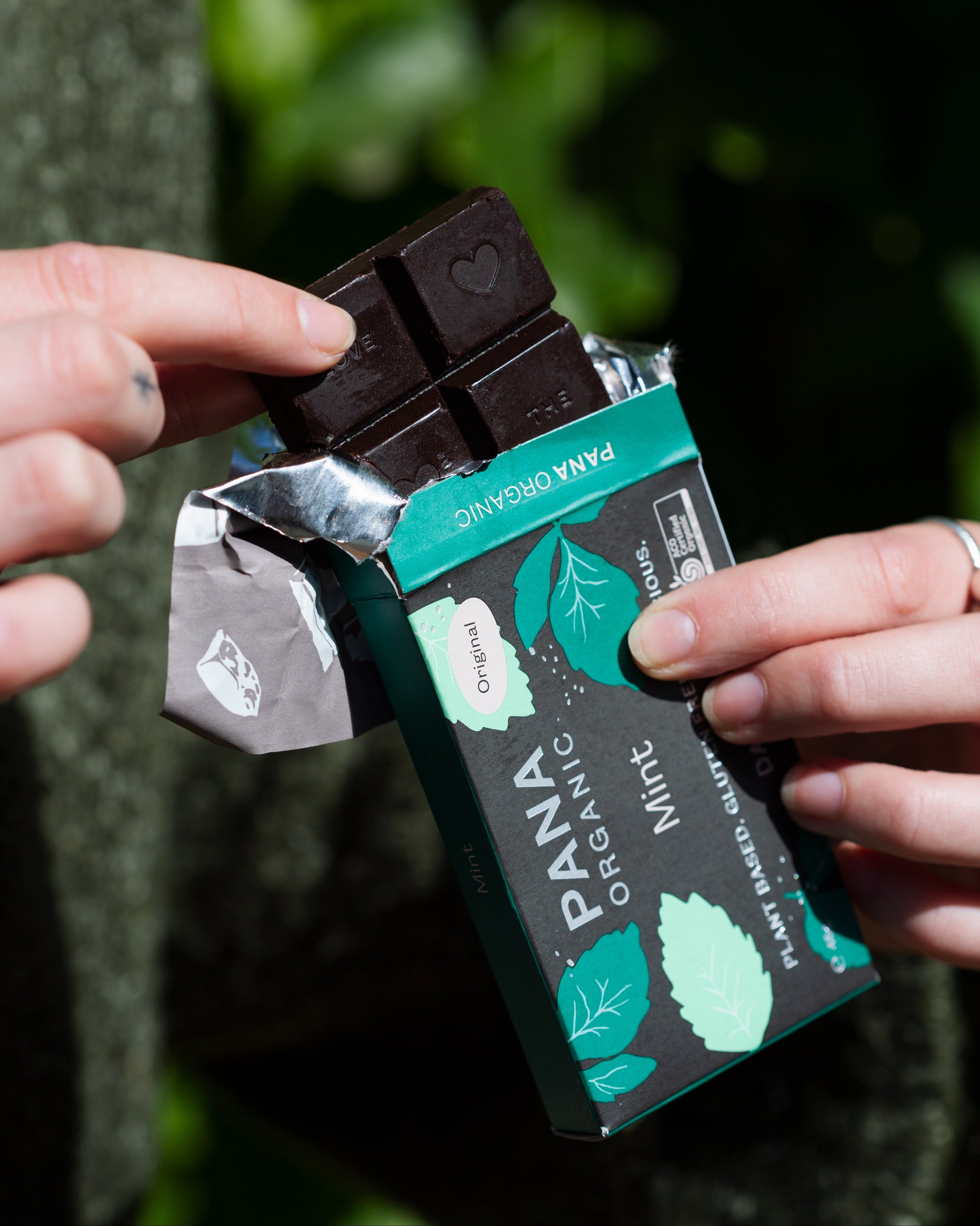 A curated selection of three handmade organic chocolate bars and a rich hot chocolate mix, perfect for cozy moments and gifting.