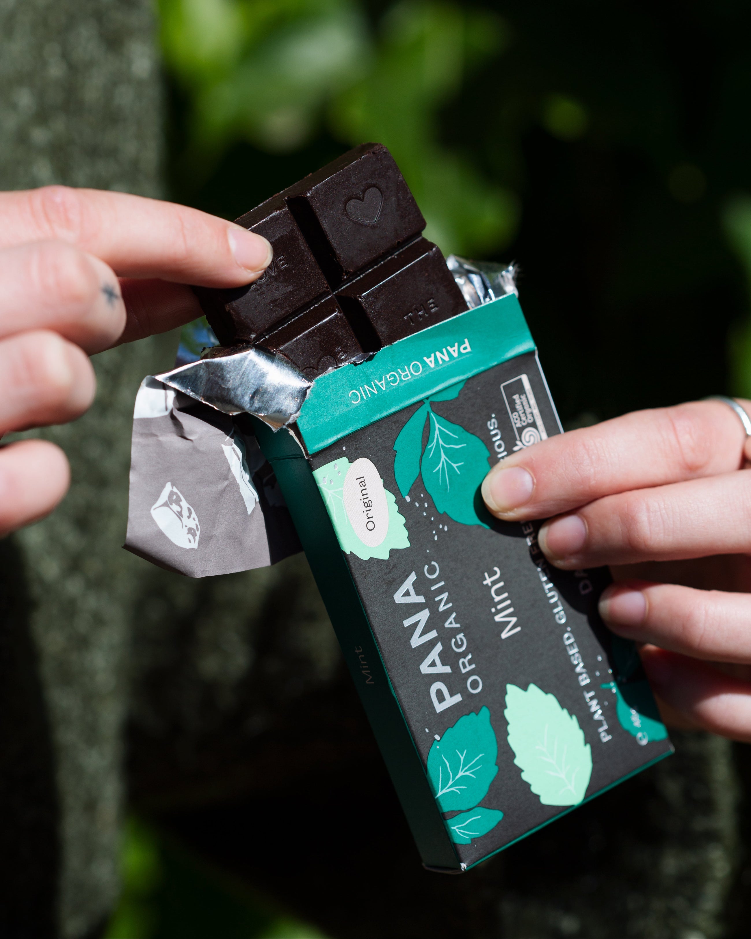A curated selection of three handmade organic chocolate bars and a rich hot chocolate mix, perfect for cozy moments and gifting.