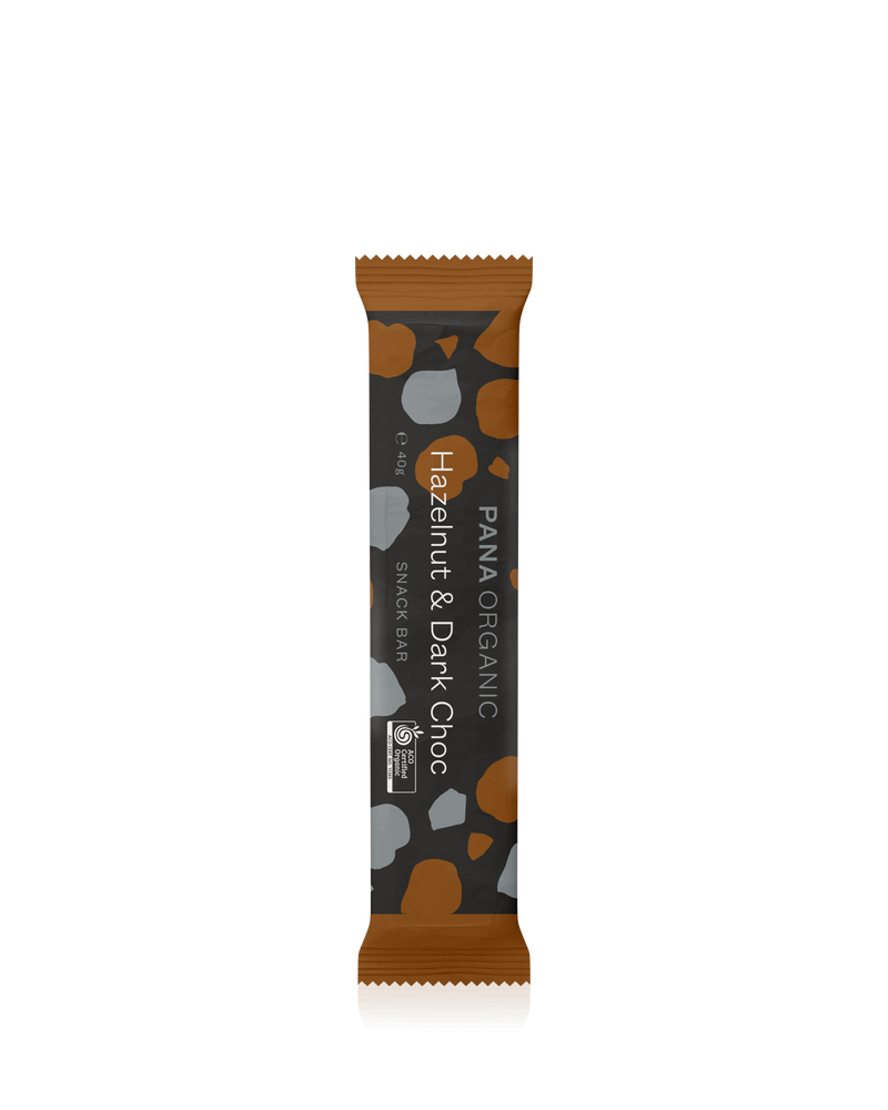 A delicious snack bar with caramelized dates, roasted hazelnuts, and a dark chocolate coating.