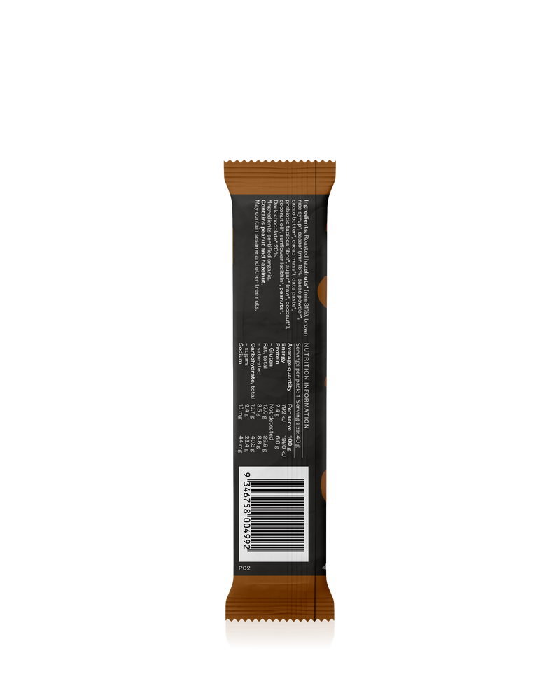 A delicious snack bar with caramelized dates, roasted hazelnuts, and a dark chocolate coating.
