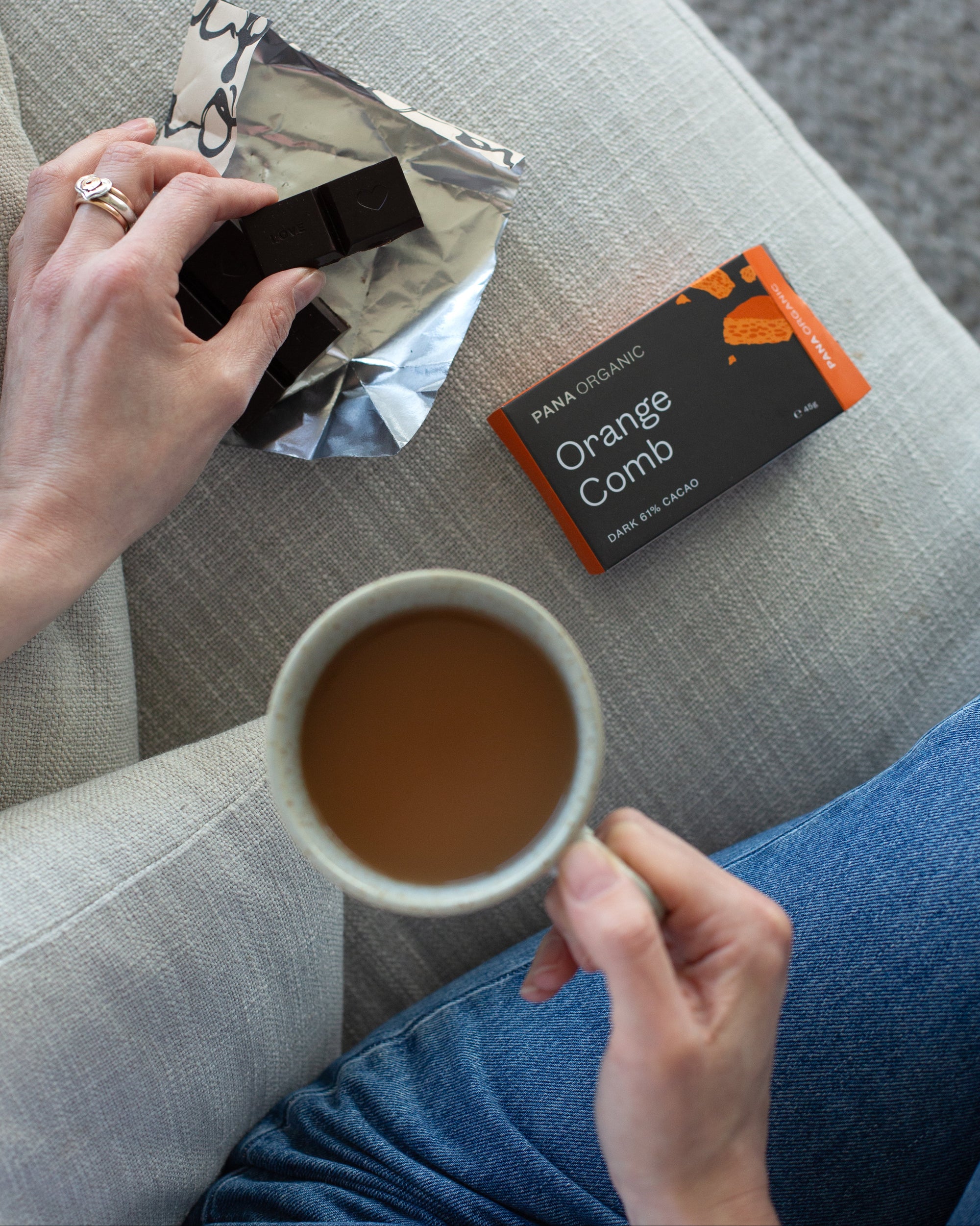 An assortment of handmade and hand-wrapped organic chocolate bar from Pana Organic, perfect for on-the-go snacking or indulging in mixed flavors.